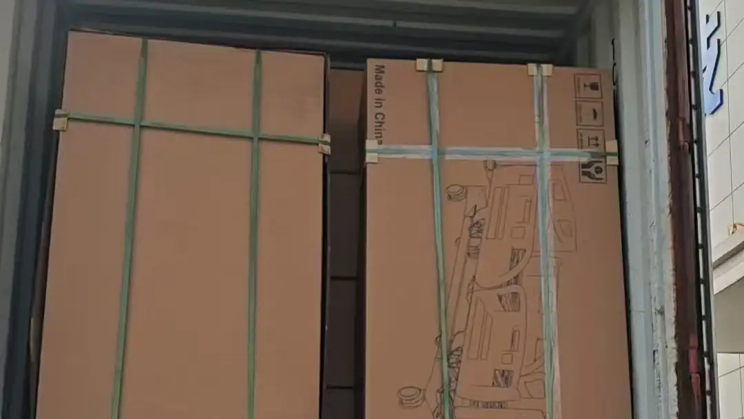 Hospital bed export cartons secured inside a shipping container at the SHLION factory