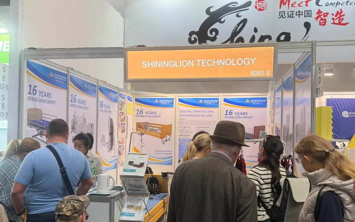 Visitors at the SHLION booth during REHACARE 2026 in Düsseldorf
