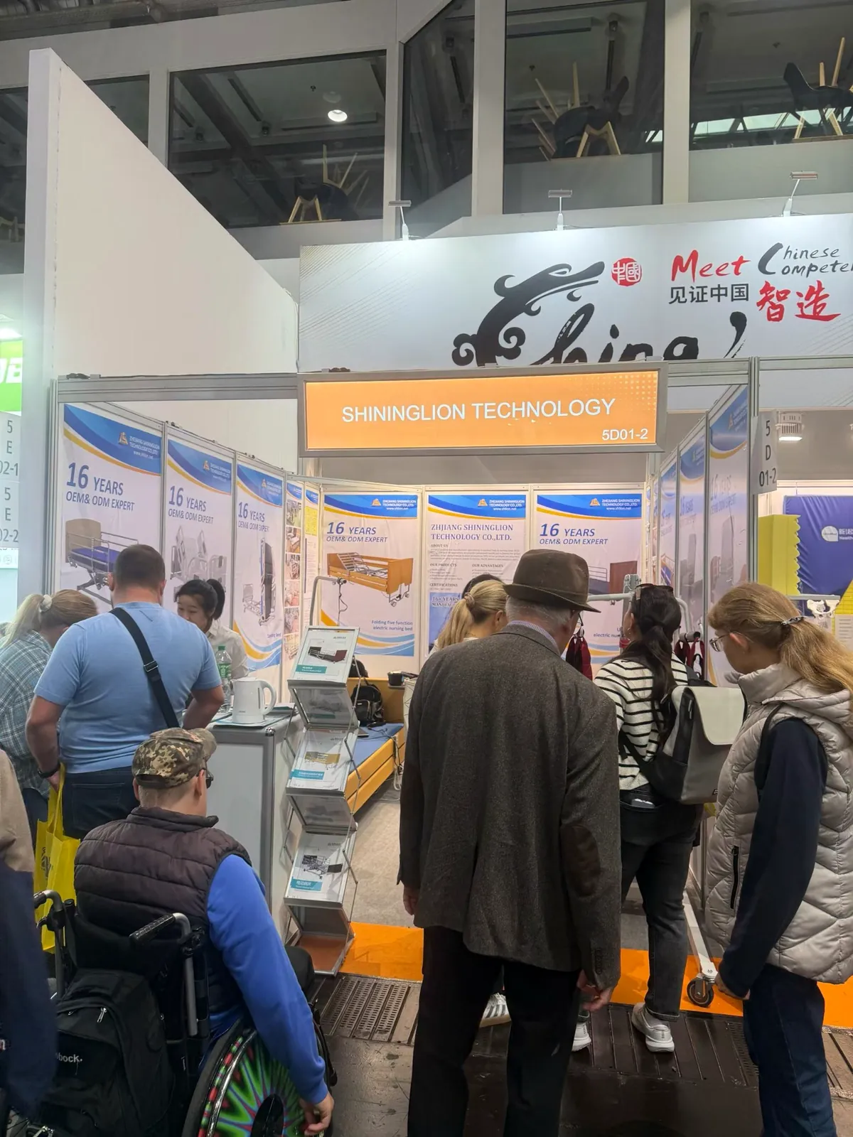 Visitors at the SHLION booth during REHACARE 2026 in Düsseldorf