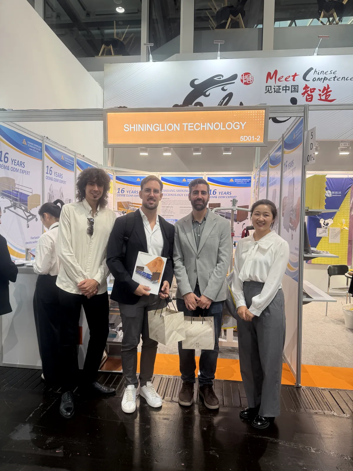 SHLION representative with visitors at REHACARE 2026