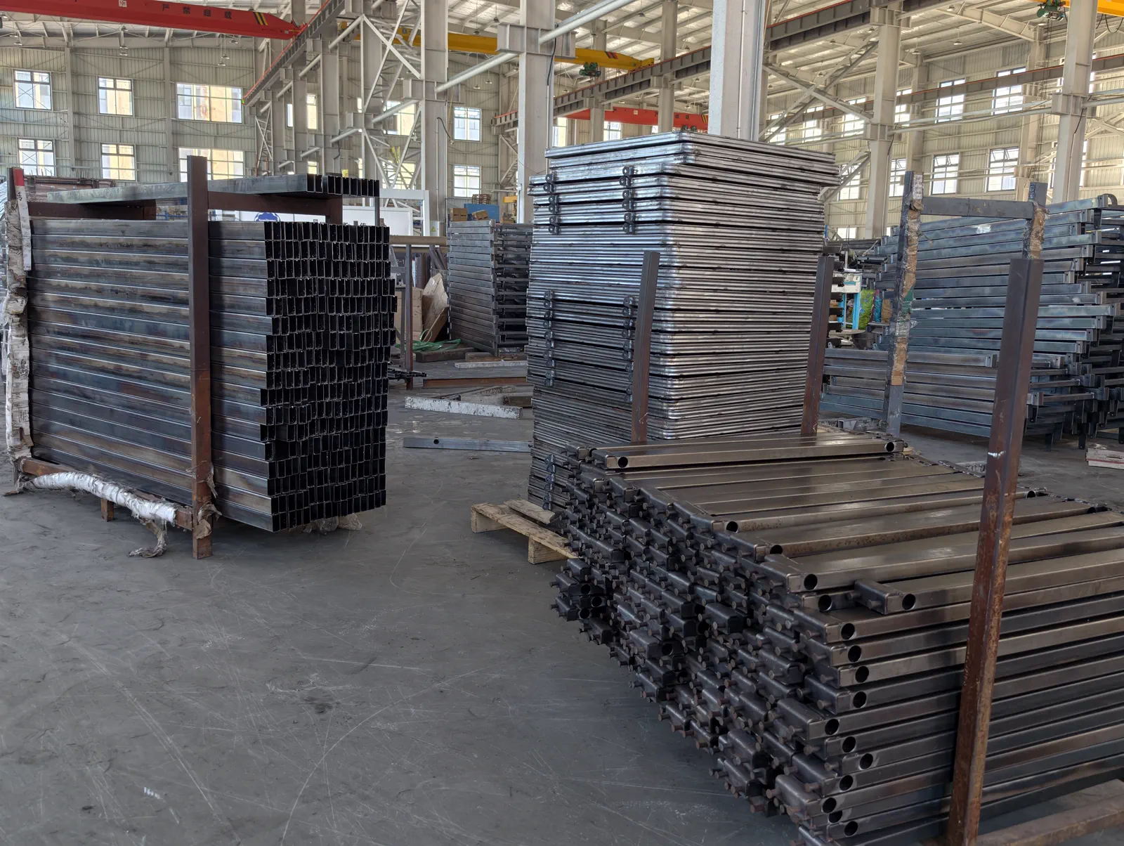 Large batches of metal frame components ready for the next production stage